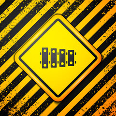 Black Xylophone - musical instrument with thirteen wooden bars and two percussion mallets icon isolated on yellow background. Warning sign. Vector.