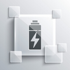 Grey Battery icon isolated on grey background. Lightning bolt symbol. Square glass panels. Vector.