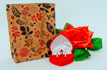 gift box with a rose and a box with rings