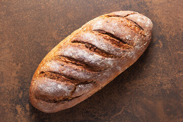 Loaf of fresh bread on table