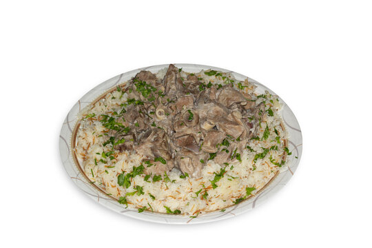 Mansaf, a traditional Arab dish made of lamb cooked in a sauce of fermented dried yogurt and served with rice or bulgur. 