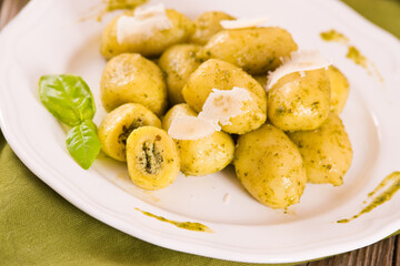 Naklejka na ściany i meble Potato gnocchi stuffed with pesto sauce. 