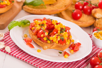 Friselle with tomatoes and mais.

