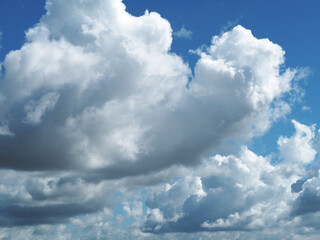 The white clouds gathered in a group and there was a blue sky.