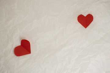 hearts made of paper for valentine's day on crumpled background with copy space