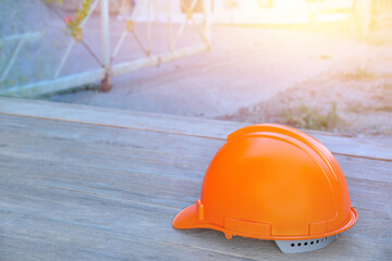 yellow safety helmet on wooden floor in construction site