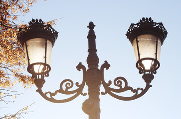 Fototapeta na wymiar Wrought iron street lantern against the sky