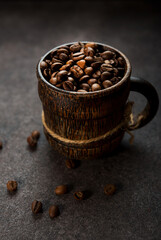 Roasted coffee beans on a dark background, close-up