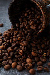 Roasted coffee beans on a dark background