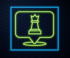 Glowing neon line Chess icon isolated on brick wall background. Business strategy. Game, management, finance. Vector.