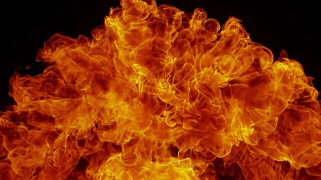 Super Slow Motion Detail Shot of Fire Explosion Against the Black Wall at 1000fps.