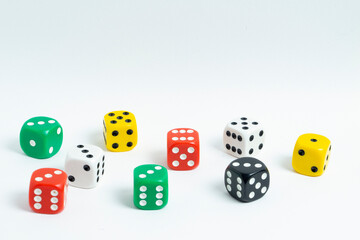 Mixed color standard size dice isolated on white background. Close up