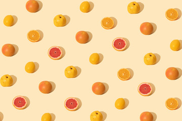 Creative pattern made with fresh fruit on  nude background. Minimal summer layout.