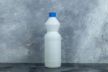 White container of bleach on marble background - obrazy, fototapety, plakaty