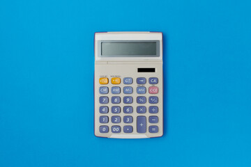 flat lay with calculator on blue