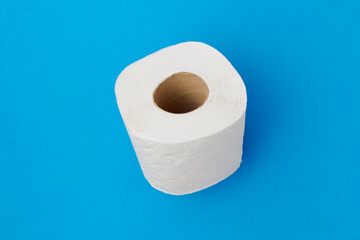 flat lay with toilet paper on blue