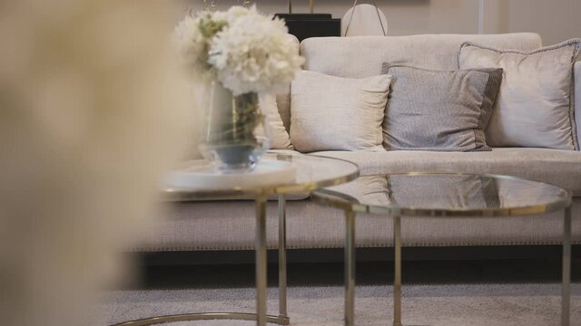 dolly shot of close up sofa beige color fabric pillow cushions luxury home interior decoration concept
