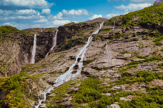 A color image of a waterfall in the Norwegian countryside.
