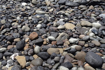 Fototapeta na wymiar volcanic stones on the beach