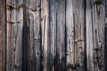 The weathered exterior of a natural finish shed wall
