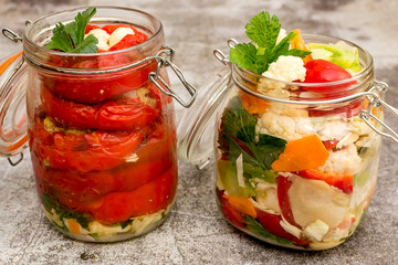 Jar of pickled cauliflower, red bell peppers and carrots