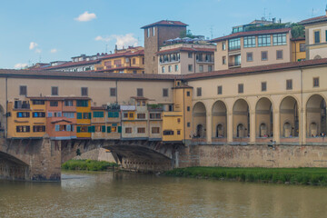 Fototapeta na wymiar View of medieval stone bridge Ponte Vecchio and the Arno River from the Ponte Santa Trinita (Holy Trinity Bridge) in Florence, Tuscany, Italy. Florence is a popular tourist destination of Europe