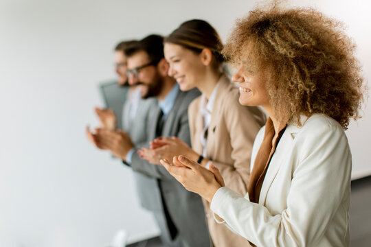 Smiling Business Group Clapping Hands After The Meeting