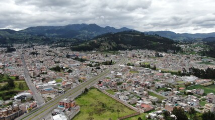 Fototapeta na wymiar Aerial view of beautiful panoramic view of the city of Otavalo in Ecuador 