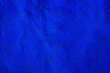 Blue colored abstract wall background with textures of different shades of blue