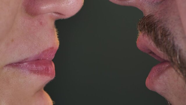 The man talked to the woman. Only lips are close-up
