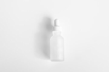 Hyaluronic acid bottle on a light background..