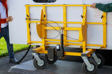 Workers lifting and installing with maple granite counter in kitchen