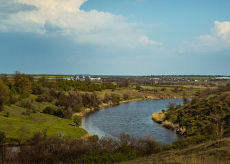 river, clouds in the sky