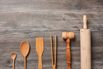 Top view set of wooden utensils for cooking flour and desserts.