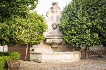 Obraz premium Antique water fountain at the big square (Fuente de la Plaza) in Castrojeriz, province of Burgos, Castile and Leon, Spain