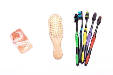 Teeth brush, hair brush and soap isolated on the white background.