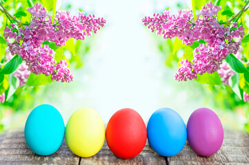 colorful easter eggs on flower background with copy space. Easter background