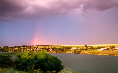 rainbow on the opposite river bank