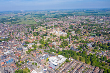 Aerial footage of the Lincoln Cathedral, Lincoln Minster in the UK city centre of Lincoln East Midlands on a bright sunny summers day showing the historic Cathedral Church in the British city centre