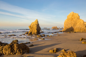 Sea stacks and rocks in the sun on Malibu beach in California
