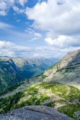 Obraz premium Taiga. Siberia. Mountain landscape with beautiful clouds in the deep sky. Ergaki. Western Sayan.