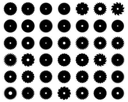 Black silhouettes of circular saw blades on white background	