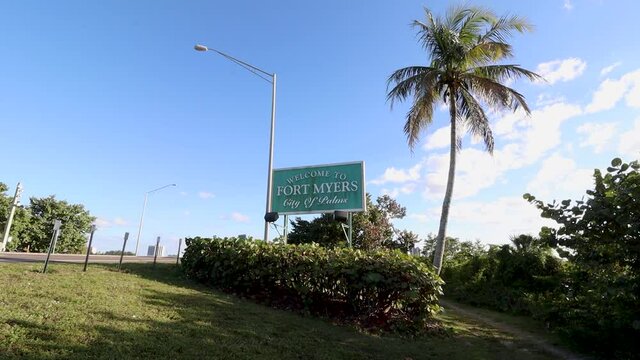 Welcome to Fort Myers city of palms Sign Greets Tourists and residents as they reach the bridge connecting Cape Coral to Fort Myers over the Caloosahatchee river. 
