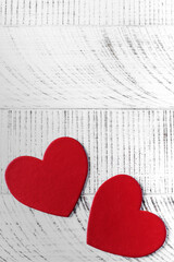 Valentine's Day background. Two hearts on a wooden background. Copy space.
