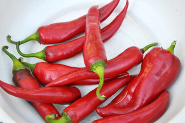 Red chili pepper lies in a bowl