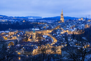 Old town of Bern in winter blue hour with snowy and illuminated buildings, Rosengarten, Bern,...