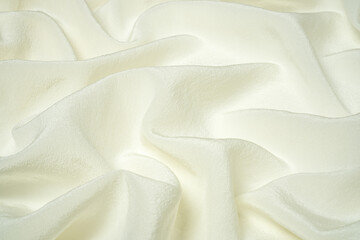 Premium quality white natural silk fabric with waves and folds. Beautiful silk background, side view, selective focus.