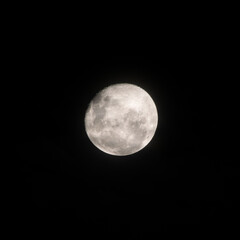 Last night of the full moon. Beginning of the waning moon. Details of the moon in dark night.