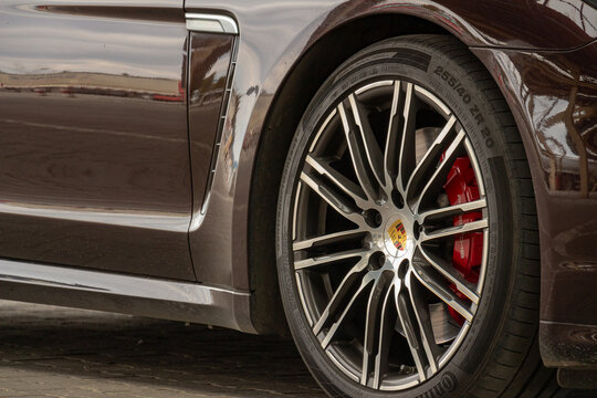 Krakovets, Ukraine - March, 2019: Front Alloy Wheels With A Sport Tires And Red Brake Calipers Of The Powerful, All-wheel Drive Premium Car Porsche Panamera GTS