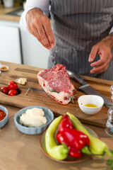 Close-up of a chef salting meat